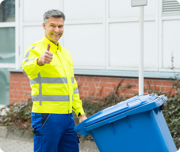 Man in safety gear with recycling bin